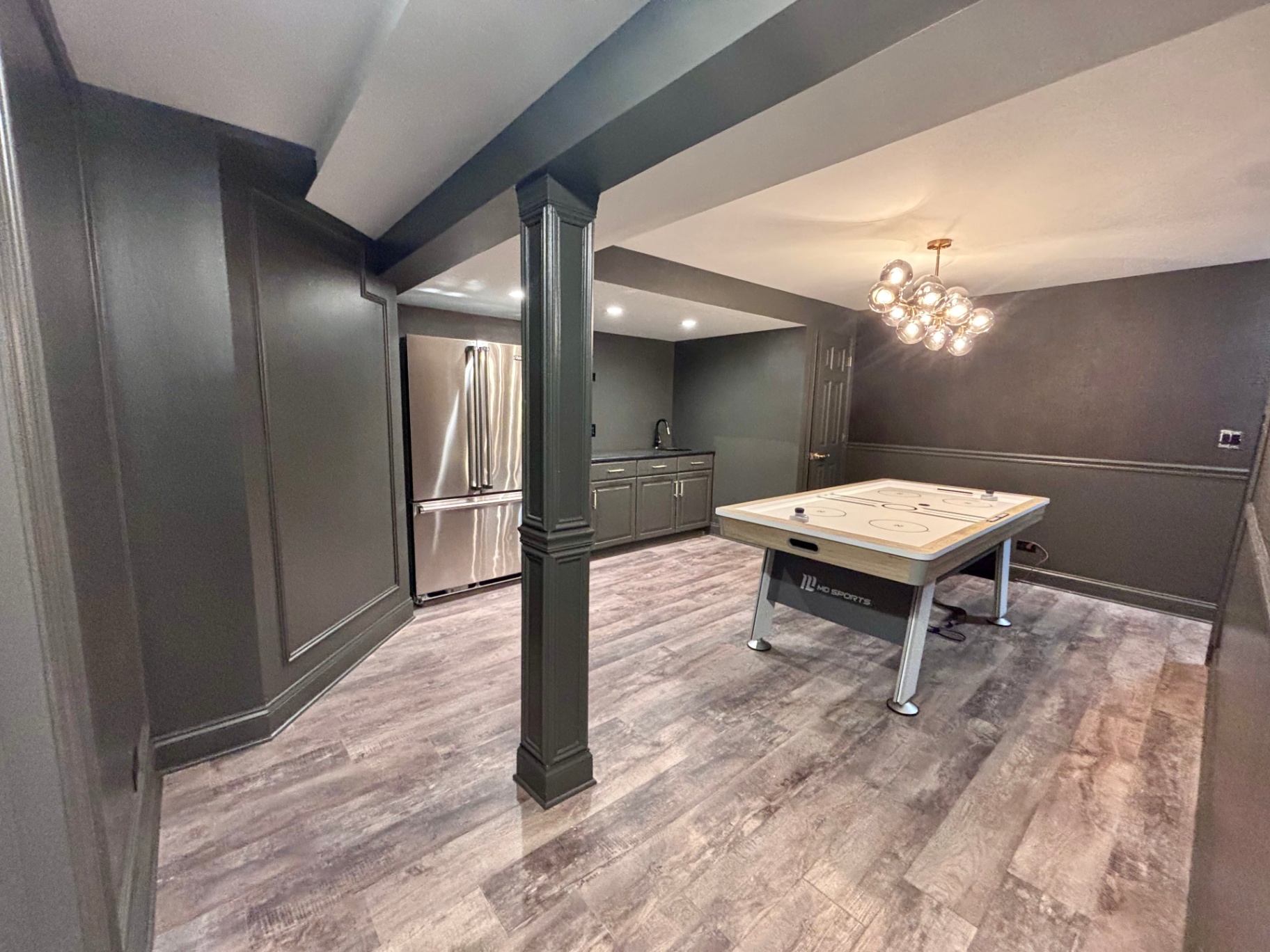 Finished basement with wet bar and game area